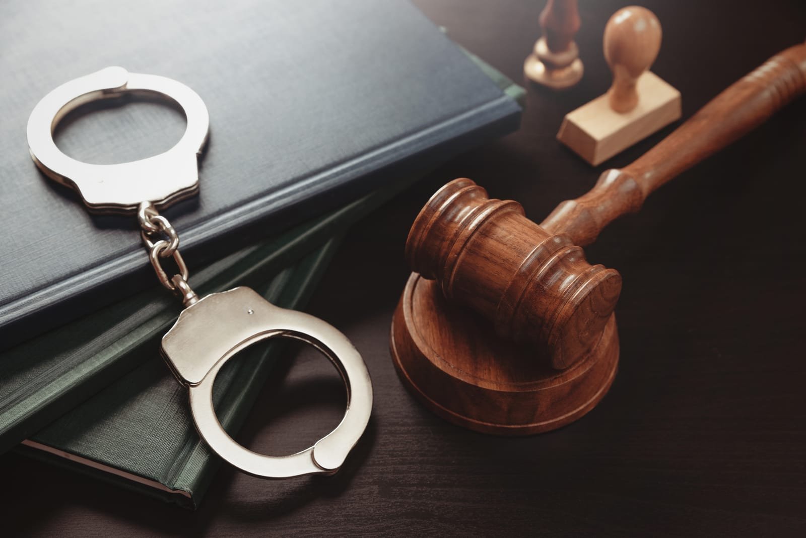 Handcuffs and Gavel on desk